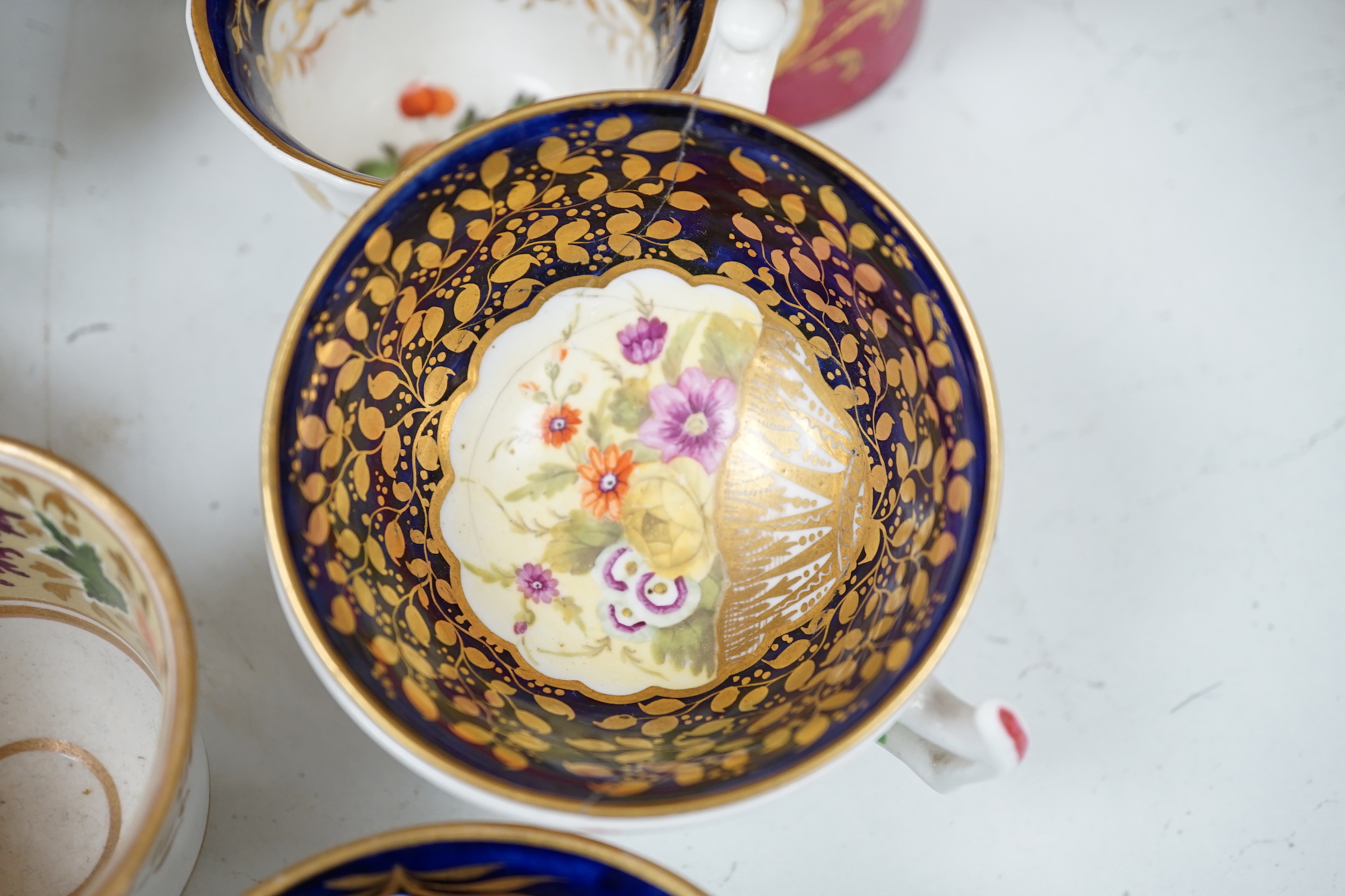 A group of Regency and Victorian porcelain tea, coffee cups and saucers, Newhall, Chamberlains, Coalport, etc.